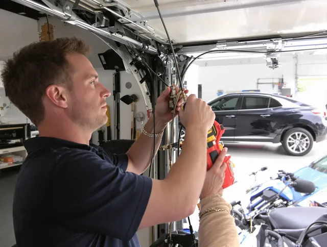 Brecksville Garage Door Repair safety certified technician performing cable replacement in Brecksville